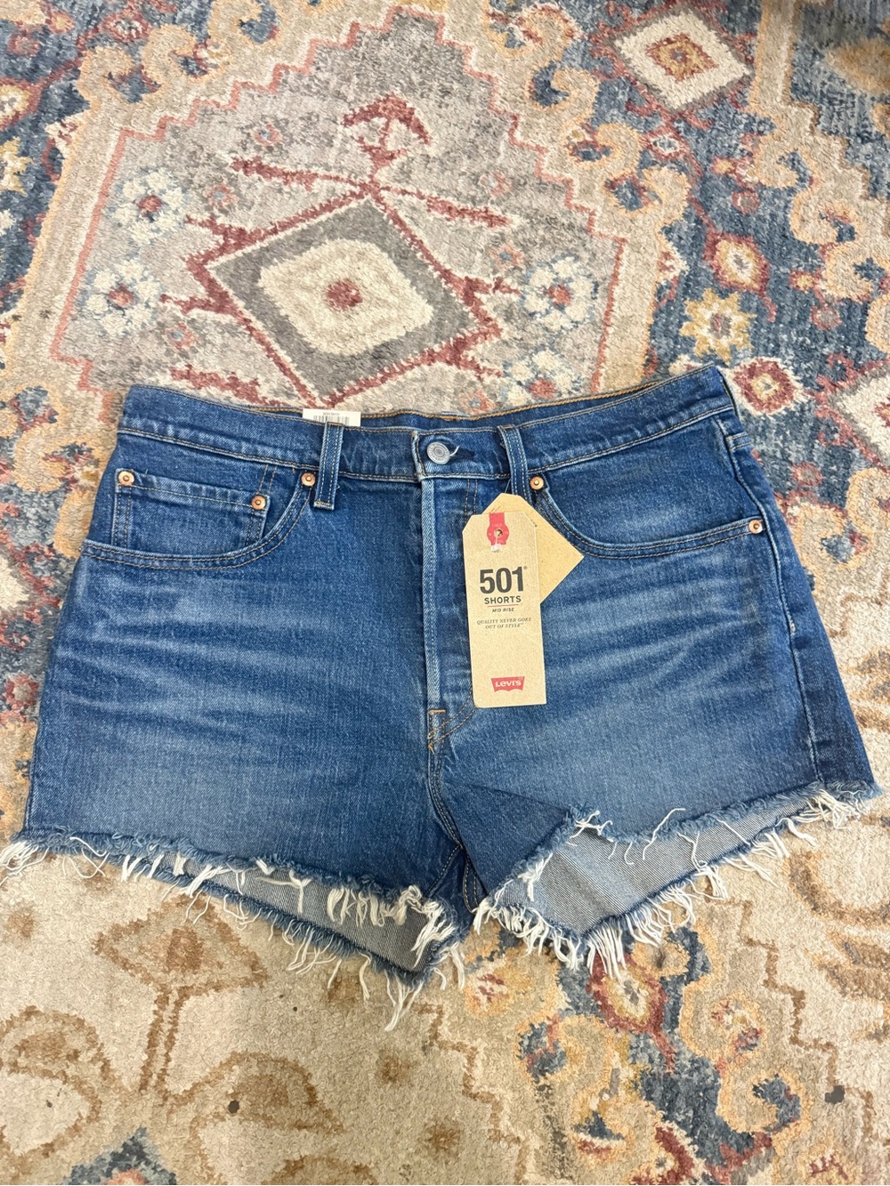 Levi's 501 Raw Hem Denim Shorts in Medium Blue